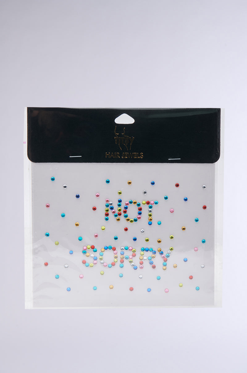 The NOT SORRY HAIR GEMS package features peel-and-stick colorful gems that spell out "NOT SORRY," with extra rhinestone accents, perfect for adding sparkle to your hairstyle. 2