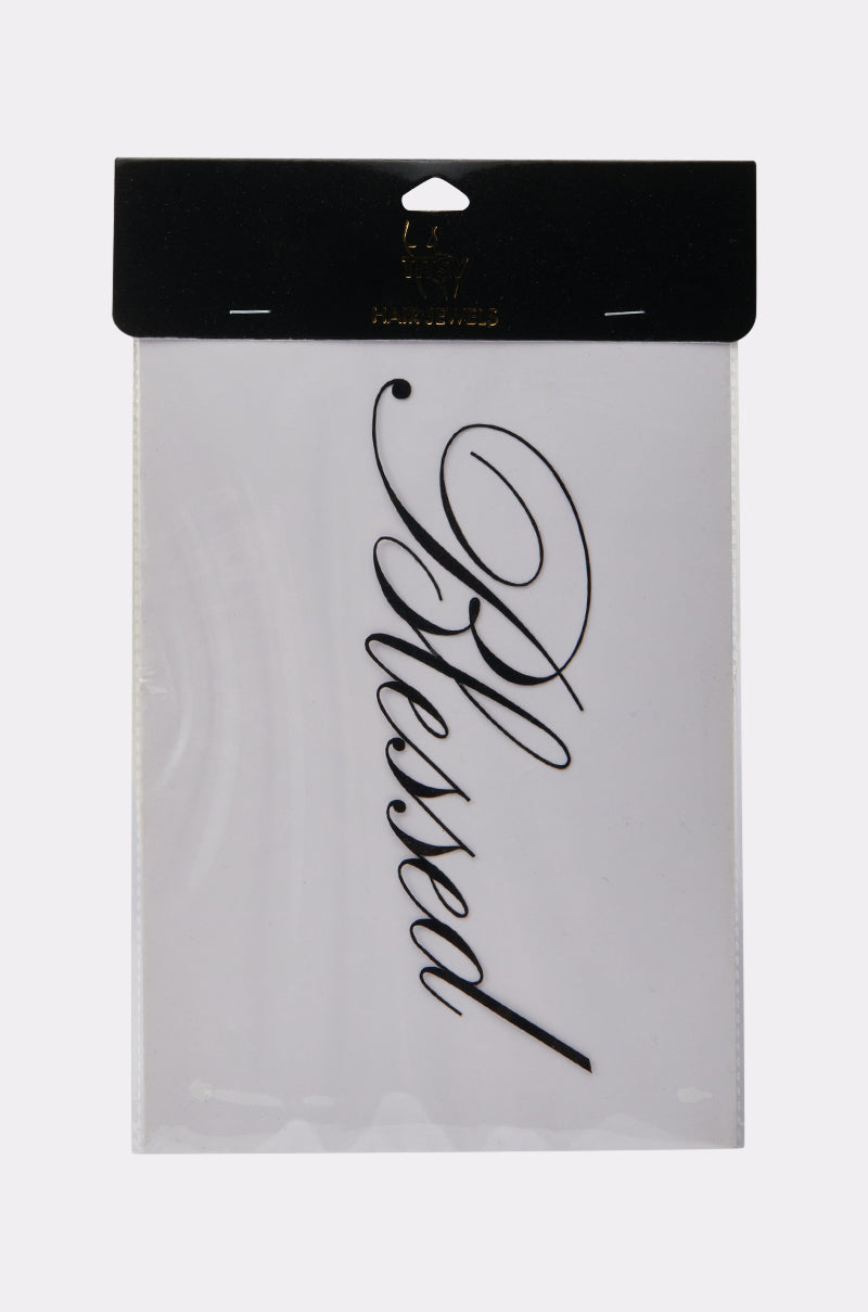 The BLESSED BODY AND HAIR STICKER is a peel-and-stick clear adhesive sheet with "Blessed" in ornate cursive, packaged in a clear sleeve with a black and gold header—ideal for personalizing your favorite items.