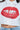 Someone is stylishly wearing the LIPS BUTTON DOWN TOP in poplin, adorned with a bold lip graphic and large red sequins on the front, paired elegantly with denim jeans for a chic look.