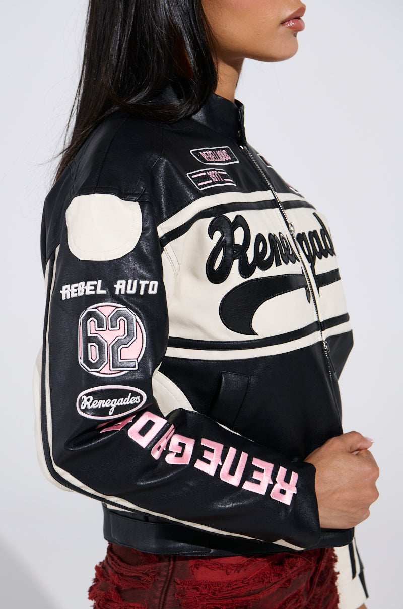 Wearing a RENEGADES EMBROIDERED MOTO jacket, black and white with various patches, the number 62 on the sleeve, and "Rebel Auto" text, they complete their bold look with red textured pants.