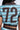 Someone wears the REBEL COLLARED TOP, a textured blue, brown, and white shirt with a colorful zigzag pattern, short sleeves, and a large dark brown 72 on the back. Only the upper back and part of the waist are visible.