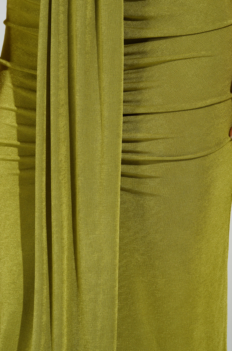 Close-up of an olive green dress with a curve-hugging silhouette, gathered fabric, and draped detail. The smooth, slightly stretchy texture creates elegant folds for a sophisticated look reminiscent of the VANJA SLINKY MIDI SKIRT.