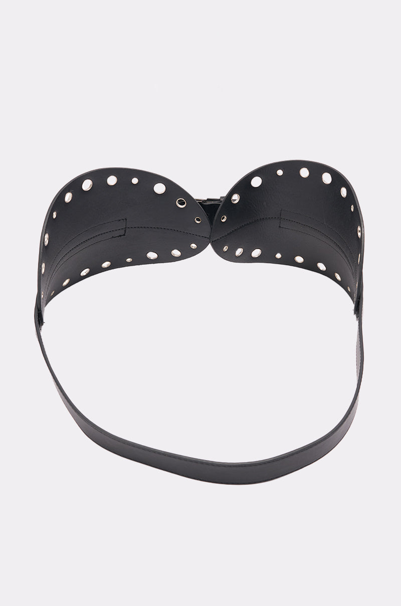 The CINCH IT BELT is a black leather bra-style harness featuring circular cut-out holes on the cups and a wide hourglass waist belt, shown against a plain white background. 4