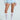 Adorned in the SHAKE IT BABY RUFFLE SHORT IN BABY BLUE, a crochet top, sheer white knee-high socks, and white high heels, the ensemble exudes playful and vintage charm with floral lace touches against a neutral backdrop.