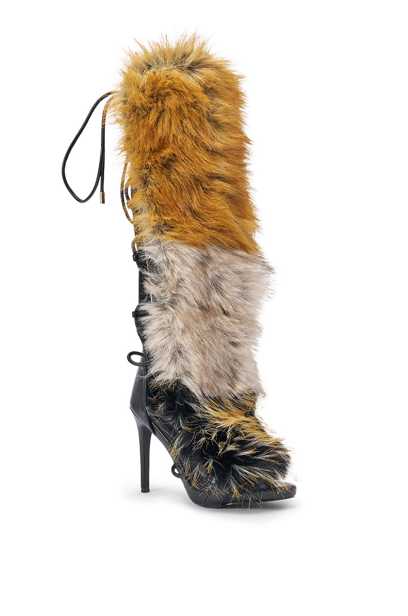 The AZALEA WANG STAMOS BLACK MULTI FUR GLADIATOR STILETTO SANDAL features striking multicolor fur in orange, gray, and black, a stiletto heel, lace-up detailing, and a pointed toe. 3