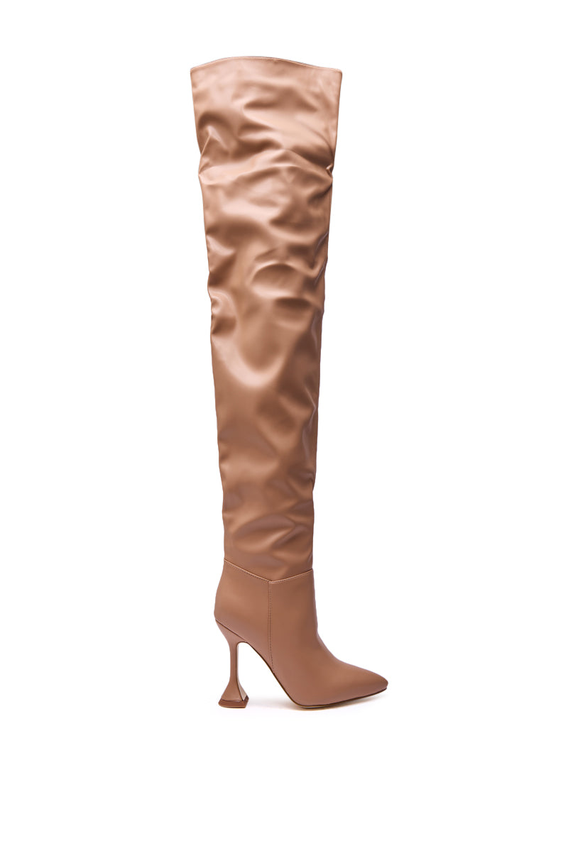The AZALEA WANG STEPHAN BEIGE PU FLARED HEEL RUCHED BOOT is a single tan thigh-high boot with a pointed toe, high flared heel, and slouchy ruched shaft, shown in profile against a white background.