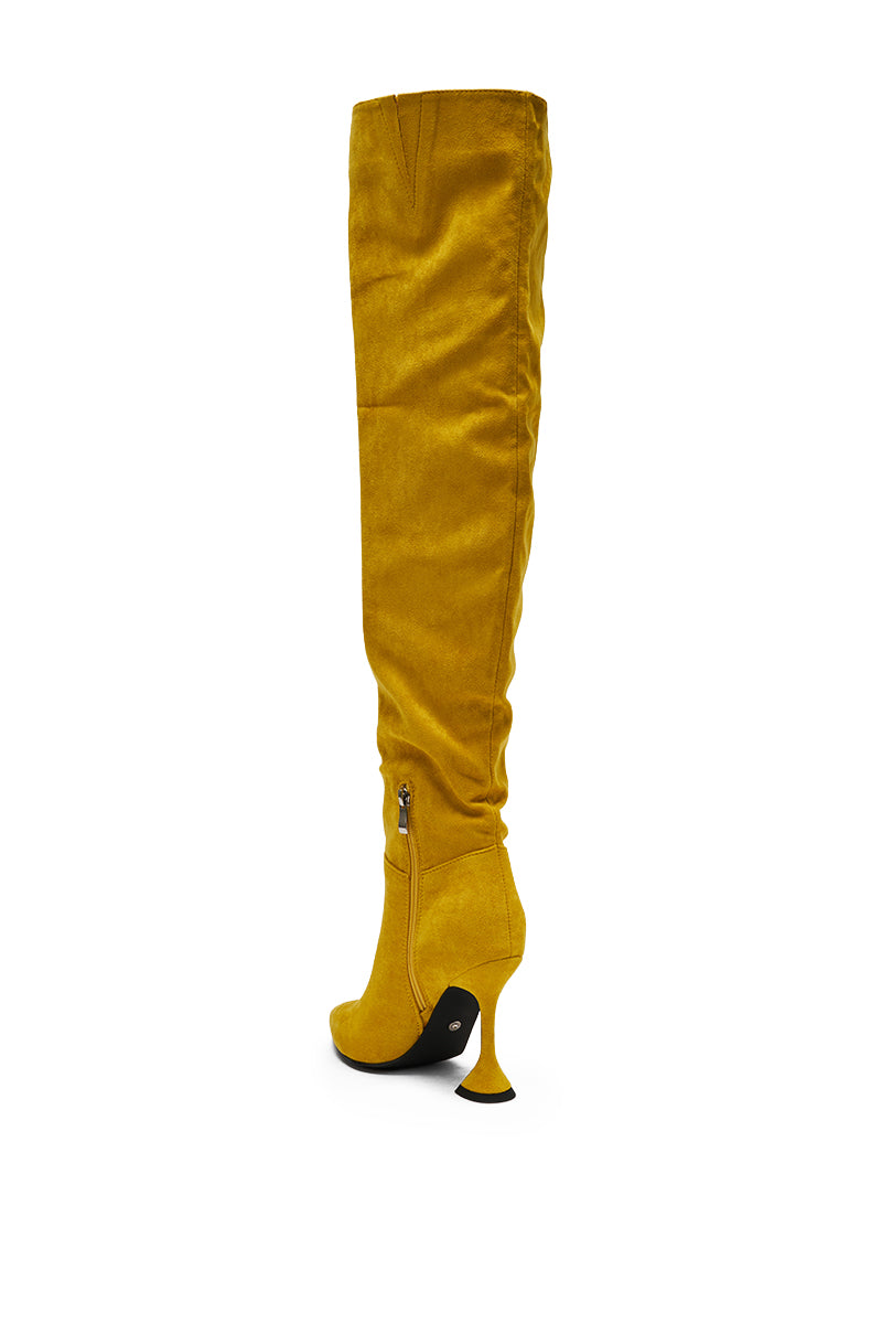 The AZALEA WANG STEPHAN YELLOW SUEDE CHUNKY BOOT is a mustard yellow thigh-high with a pointed toe, side zipper, and sculpted flared heel, displayed against a white background.