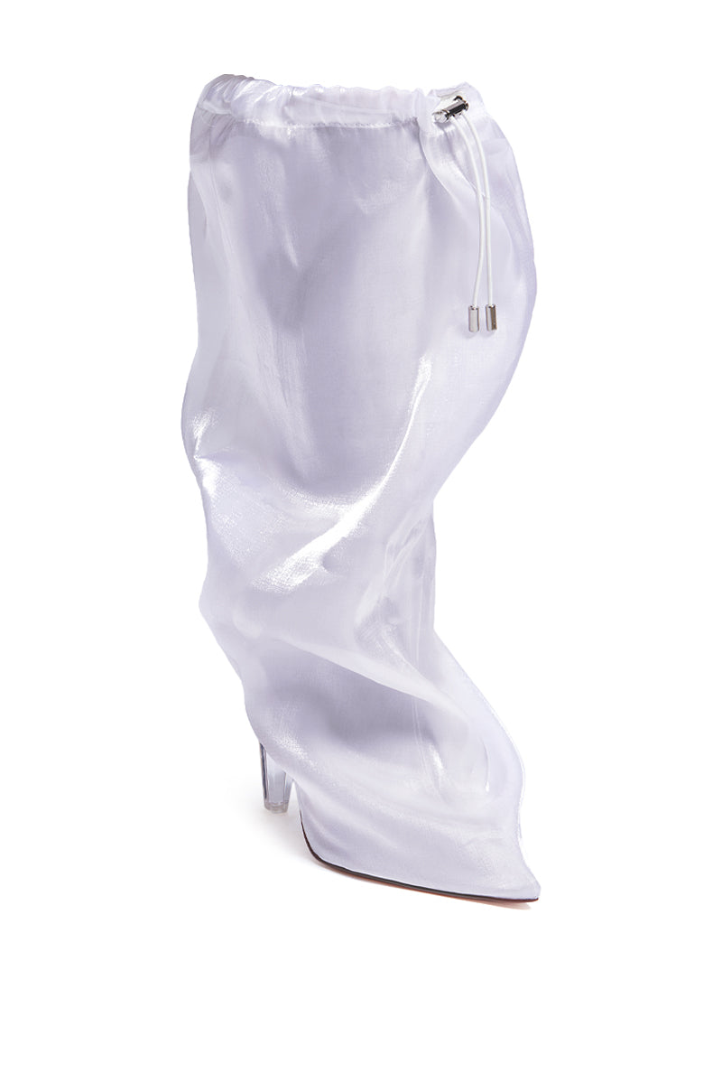 The AZALEA WANG STOKED WHITE BOOTIE is a white, sheer ankle boot with a pointed toe and stiletto heel. It features a unique drawstring top that provides a stylish look reminiscent of a knee-high shaft, all packed into an ankle boot form. The boot is depicted against a plain white background.