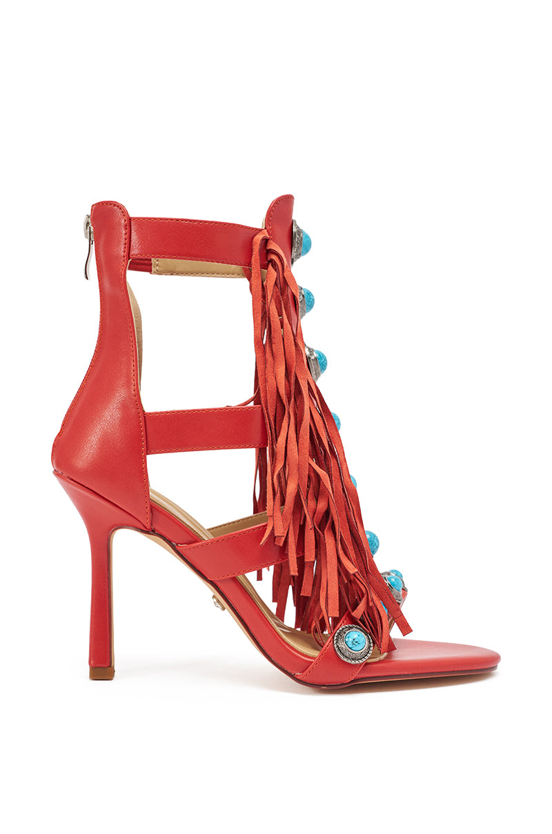 The AZALEA WANG SUMAC Red Fringe Western Stiletto Sandal features multiple straps, front fringe, blue stones, a back zipper, and open toe design for a bold, western-inspired look. 3