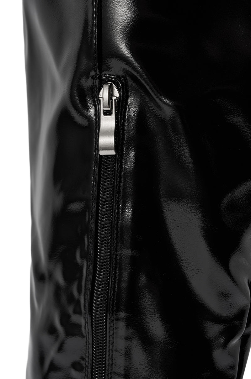 Close-up of the AZALEA WANG SUNSHINE THIGH HIGH BLACK PU STILETTO BOOT featuring shiny black faux leather and a partially zipped silver zipper running vertically along its sleek surface.