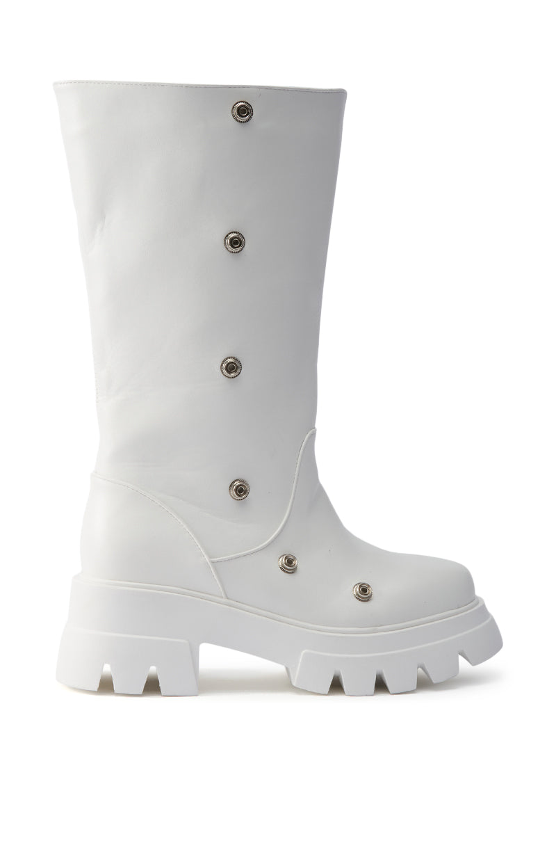 The AZALEA WANG SYBEL WHITE SNAP DETAIL BOOTIE is a white, mid-calf faux leather boot with a chunky platform lug sole, snap and metal eyelet details, and a modern utilitarian design with a smooth finish.