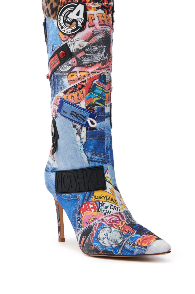 The AZALEA WANG SYTILA MULTI ABSTRACT BOOT is a knee-high stiletto featuring a denim-inspired collage with vibrant patches, text including "Authentic" and "DAIRYLAND," comic-style art, colorful images, patterns, and a thin brown heel.