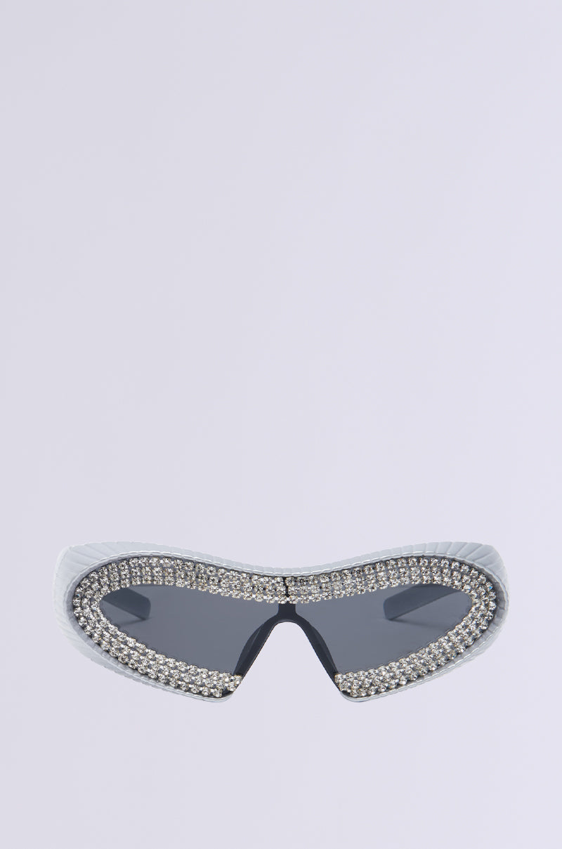 TO THE FUTURE BLING GLASSES offer a modern, futuristic look with dark lenses and a rhinestone-embellished border on a light gray backdrop.