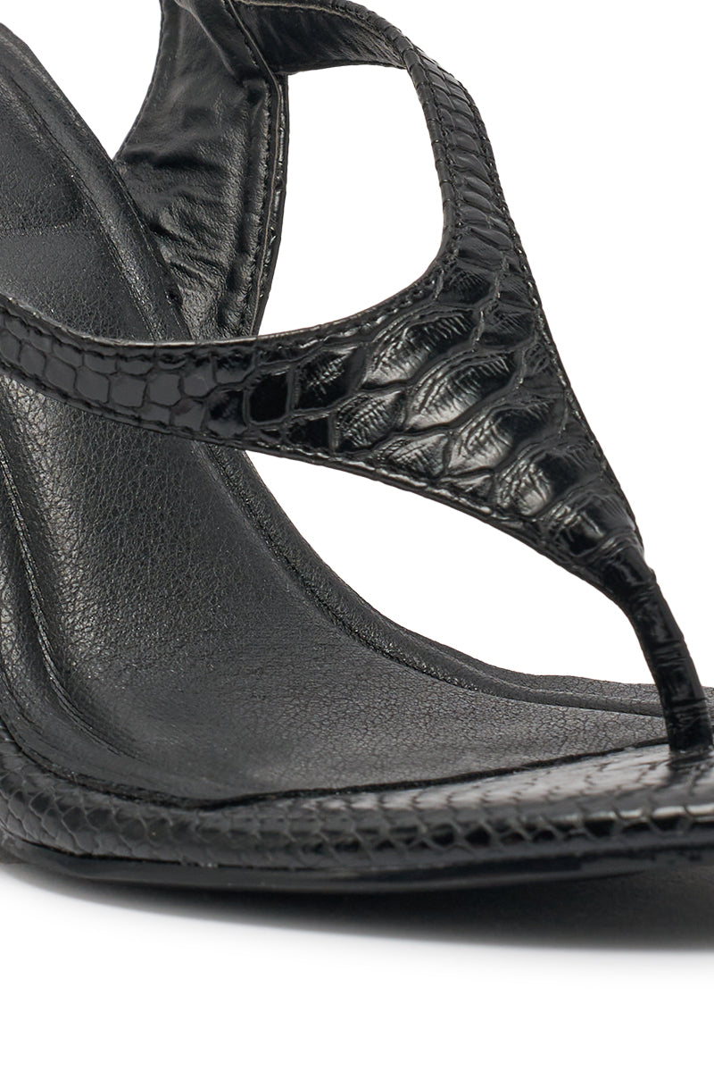 Close-up of the AZALEA WANG TAMSIN Black Croc Novelty Wedge Strap Sandal, featuring a black faux croc snakeskin texture with a detailed front strap and footbed—ideal for bold evening wear. 6