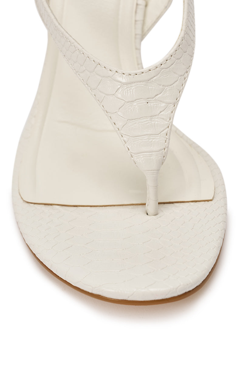 Close-up of the AZALEA WANG TAMSIN WHITE CROC NOVELTY WEDGE STRAP SANDAL, featuring white faux leather, a square toe, and detailed crocodile-textured sole and strap. 7