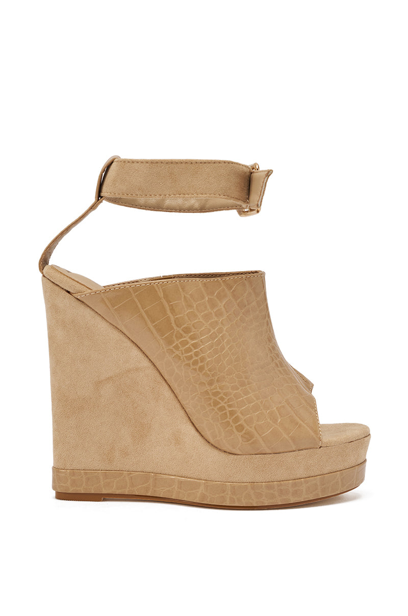 The AZALEA WANG TANA NUDE MIXED MATERIAL WEDGE is a crocodile-embossed faux leather sandal with an open toe, high platform wedge, comfort cushion insole, and adjustable ankle buckle strap. 3
