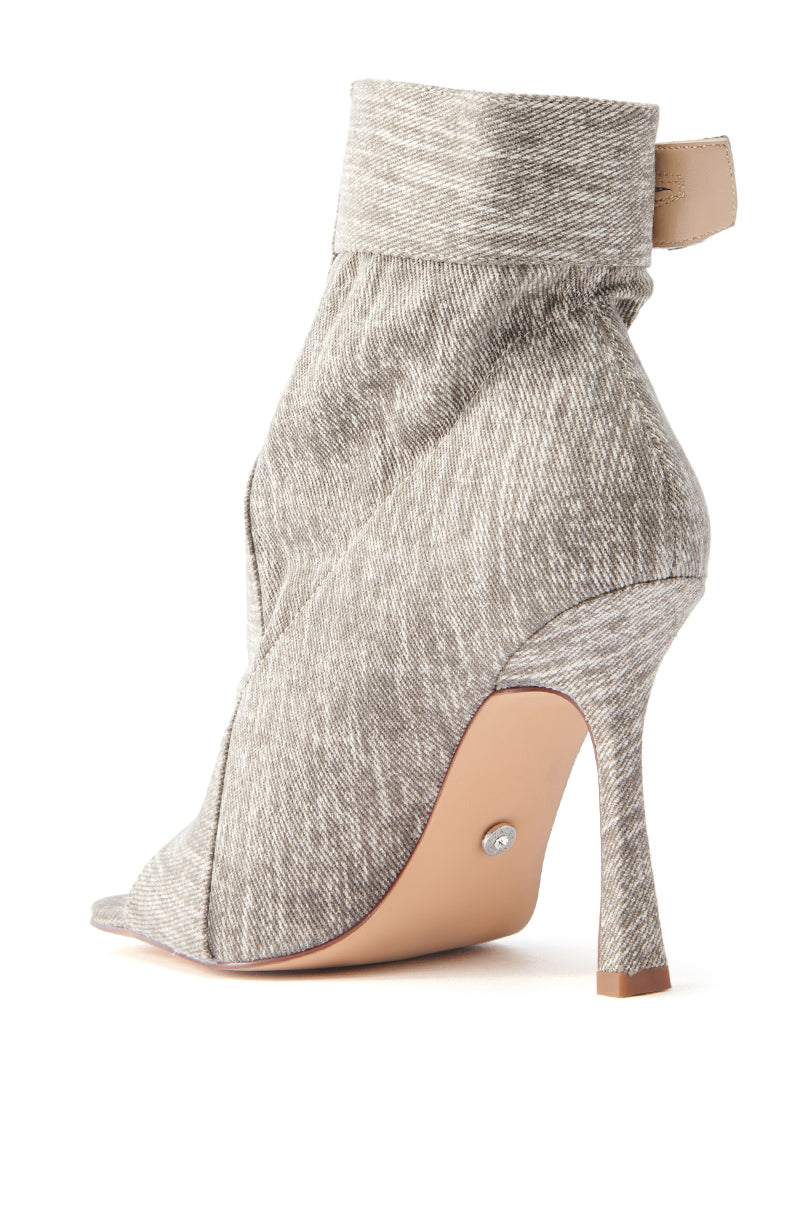 The AZALEA WANG TANDY Grey Denim Open Toe Bootie features a chic stiletto heel, peep-toe design, textured acid-wash denim look, back heel loop, and contrasting light brown sole and heel tip.
