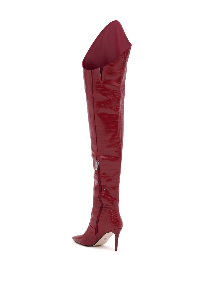 The AZALEA WANG TARRANT RED STILETTO BOOT WITH WESTERN TOPLINE features a glossy crocodile-embossed finish, pointed toe, over-the-knee fit, high heel, and side zipper, displayed against a white background. 5