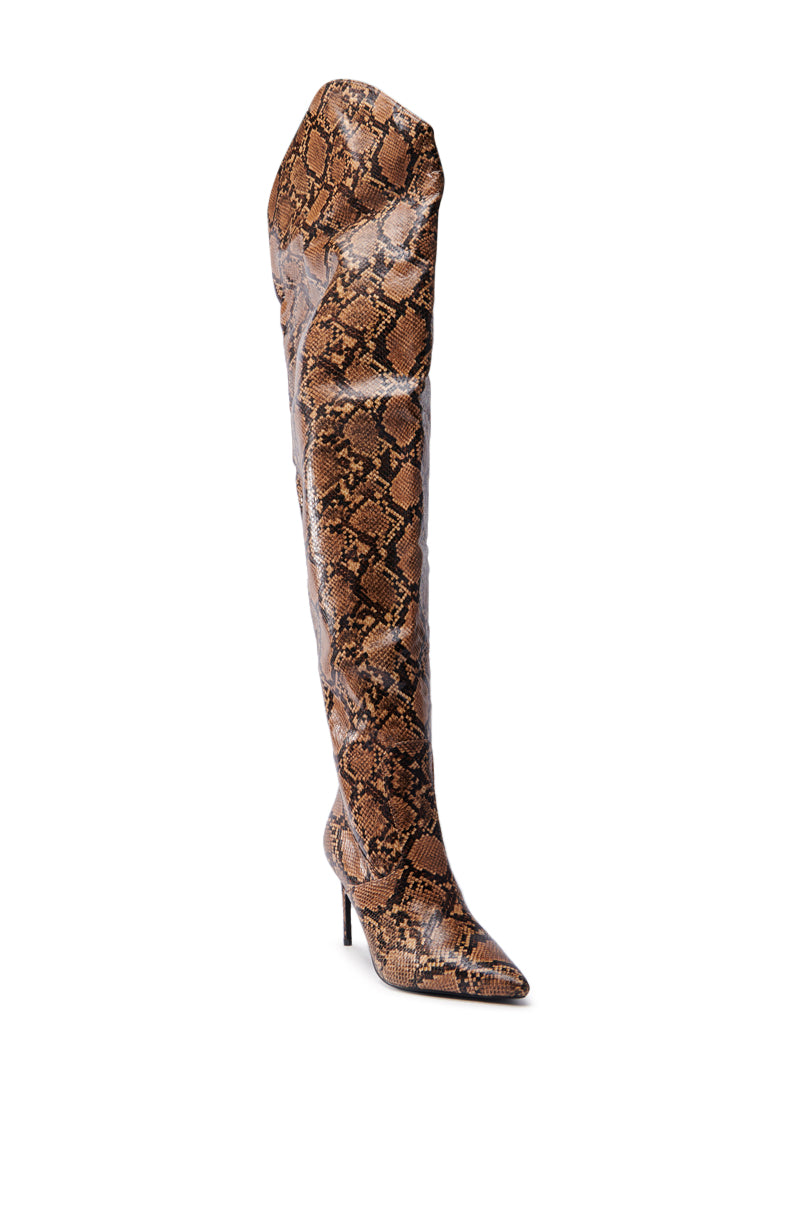 The AZALEA WANG TARRANT SNAKE WESTERN TOPLINE BOOT is a striking over-the-knee design featuring a brown and black snakeskin pattern, a pointed toe, chic stiletto heel, and is crafted from faux leather.