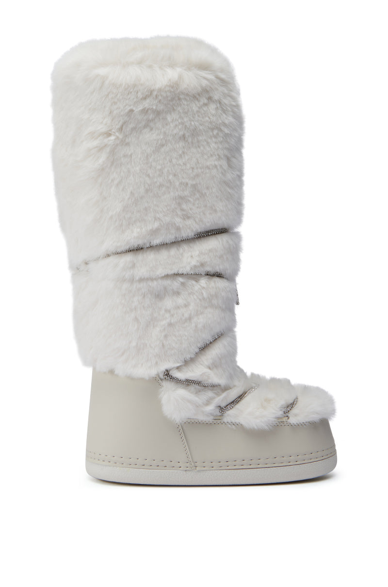 Introducing the AZALEA WANG TAYTON BEIGE FUZZY FLAT KNEE HIGH BOOT, a stylish snow boot featuring a chic faux fur upper and durable rubber sole, with crisscrossing laces. This sleek, contemporary knee-high design is an excellent choice for winter fashion.