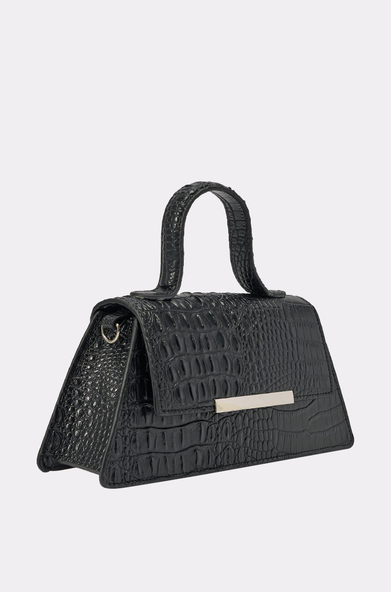 The VILLAIN ERA PURSE is a black croc-embossed faux leather handbag with a top handle, structured rectangular shape, and silver bar detail on the front flap, shown against a plain light background. 2