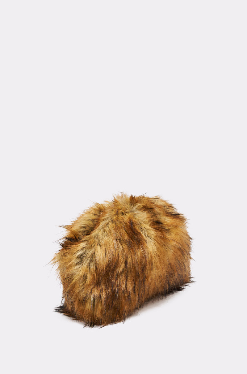 The WILD CHILD FAUX FUR CLUTCH, a rectangular brown and black bag with a fluffy, animal-inspired texture and removable chain strap, is displayed against a plain light background. 3