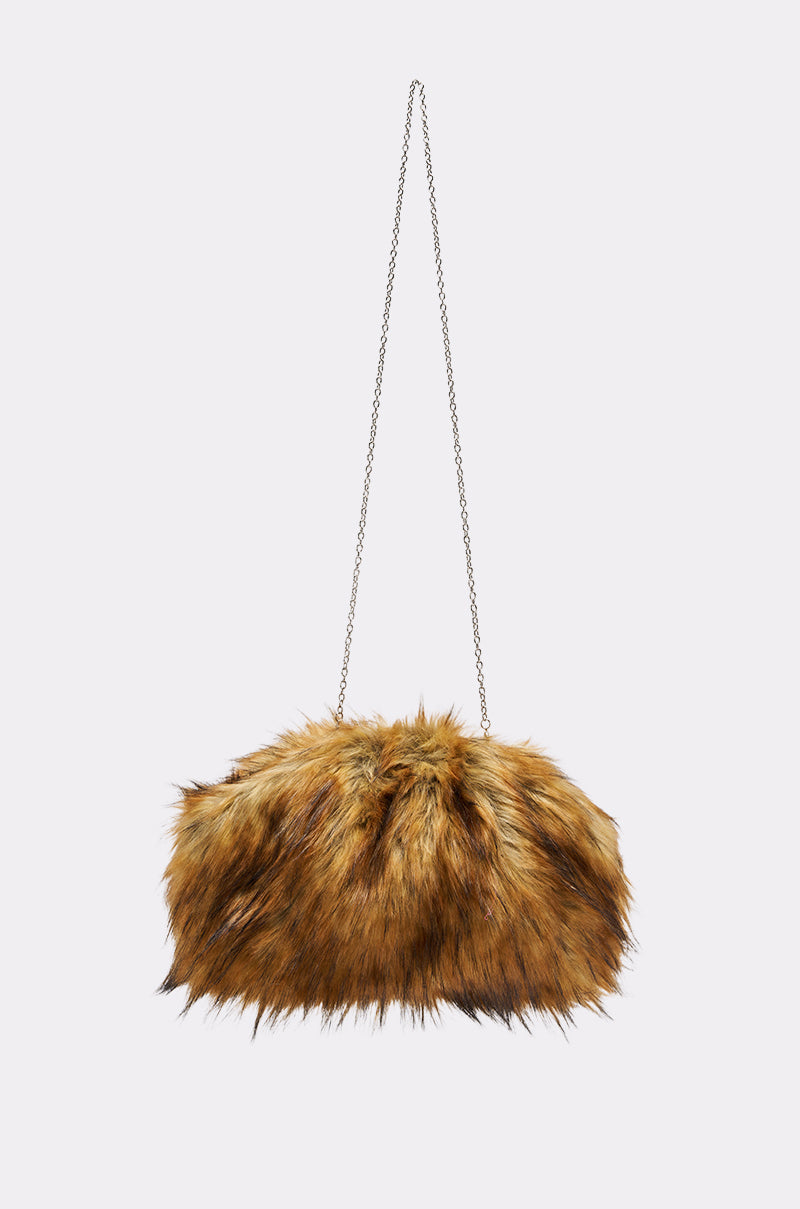 The WILD CHILD FAUX FUR CLUTCH is a brown plush handbag with black accents and a long chain link strap, shown against a plain light background. 4