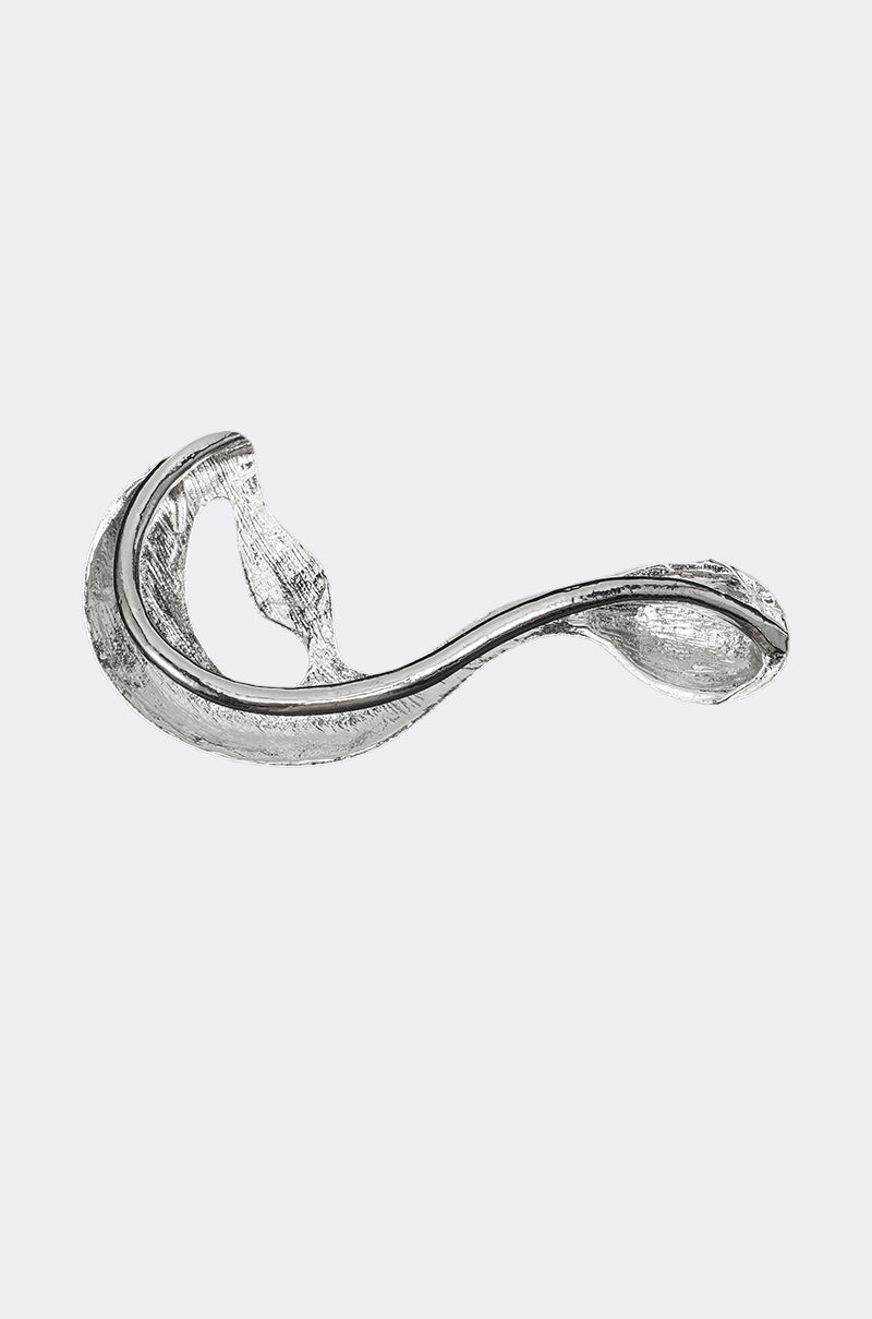 The STEF EAR CUFF features a modern, abstract silver design with smooth, looping curves and a shiny metallic finish, reminiscent of contemporary sculpture, set against a plain light gray background. 4