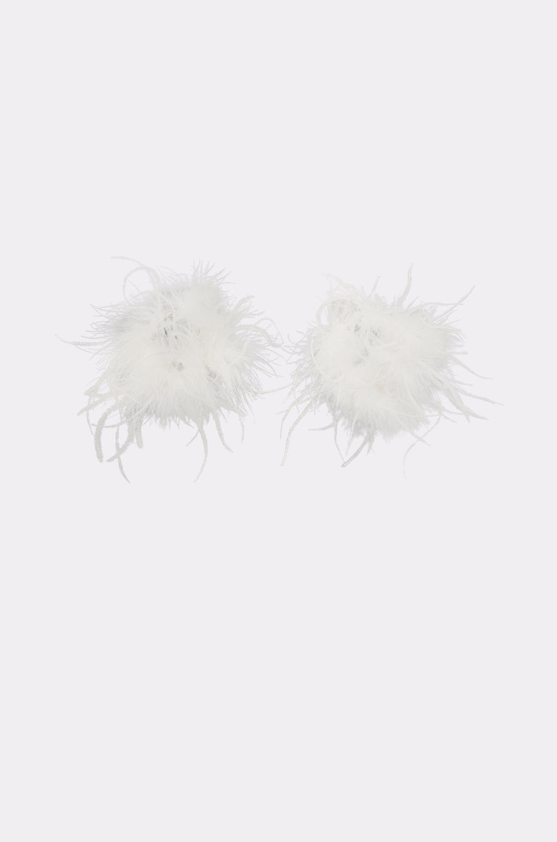The WITH IT FEATHER HOOP EARRING features white, fluffy feather pom-poms with delicate detailing, showcased on a simple light gray background. 2