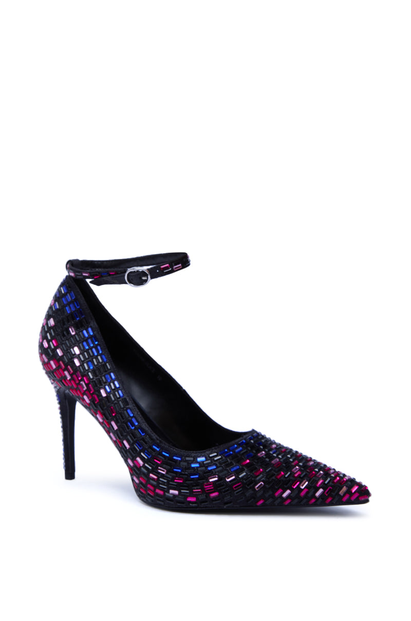 The AZALEA WANG TEAGAN BLACK MULTI RHINESTONE STRAP PUMP is a black pointed-toe stiletto heel with an ankle strap, adorned with pink, blue, and silver rhinestones—a striking suede pump for any occasion.