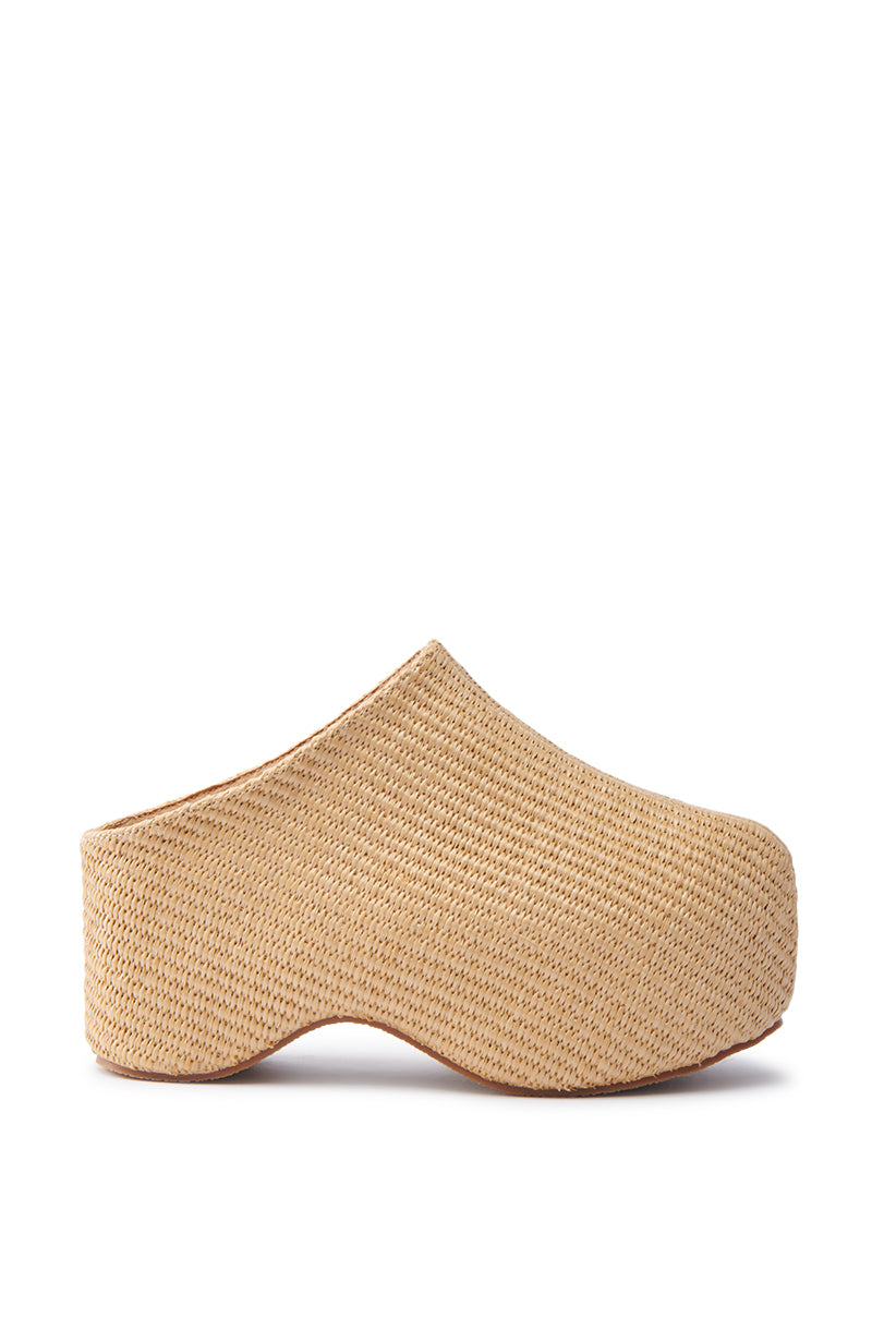 The AZALEA WANG TEATREE BEIGE CLOG is a tan woven slip-on mule with a flatform sole that boasts a textured, basket-like look. Featuring a closed toe and smooth curve design, it offers a slightly elevated base and seamless, sleek side profile.