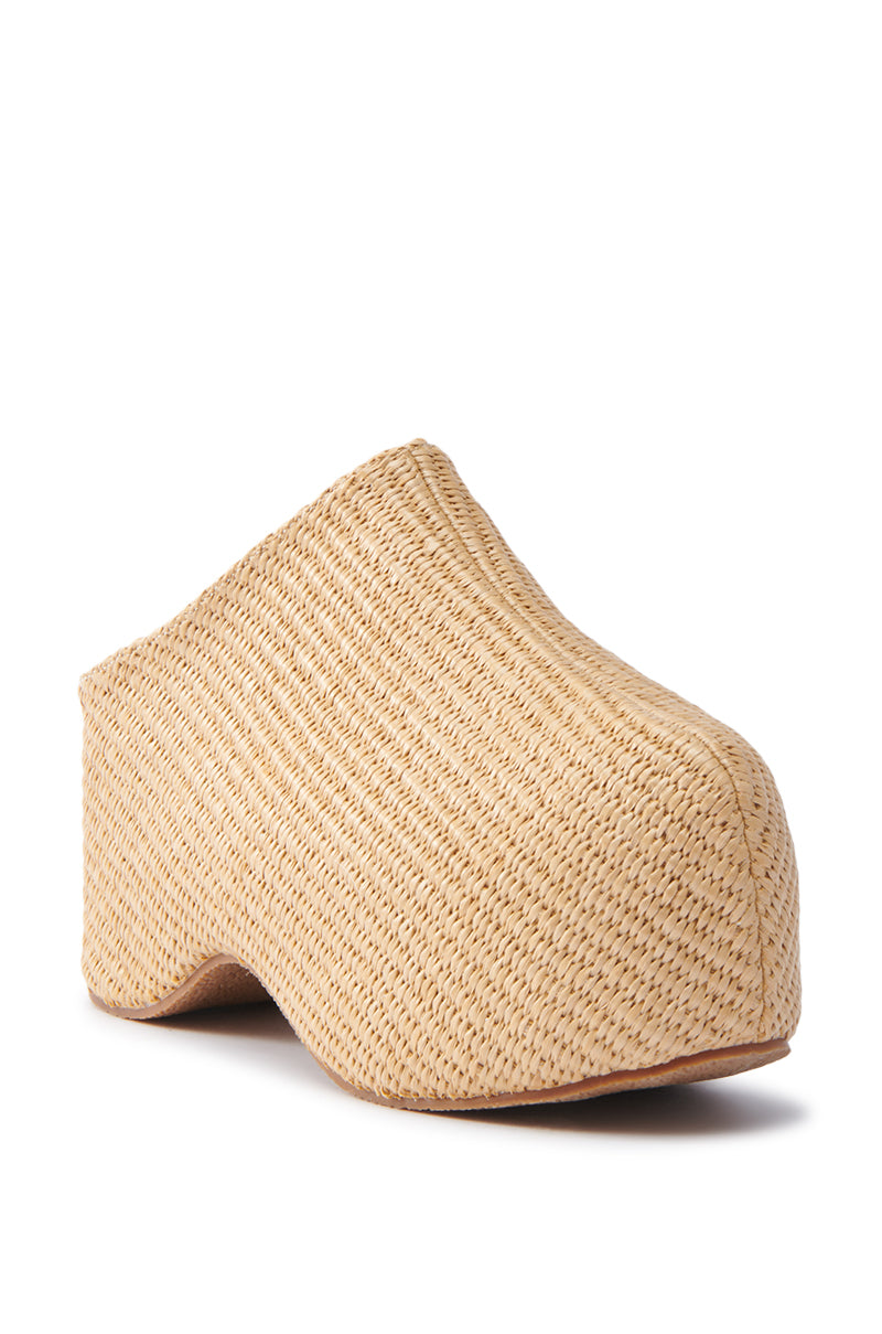 The AZALEA WANG TEATREE BEIGE CLOG features a woven design with artistic flair, a textured surface, and an elevated flatform sole, set against a plain white backdrop.