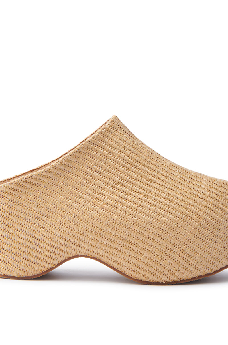 The AZALEA WANG TEATREE BEIGE CLOG features a side view of a slip-on mule shoe with a slightly raised chunky heel and detailed basket weave texture.