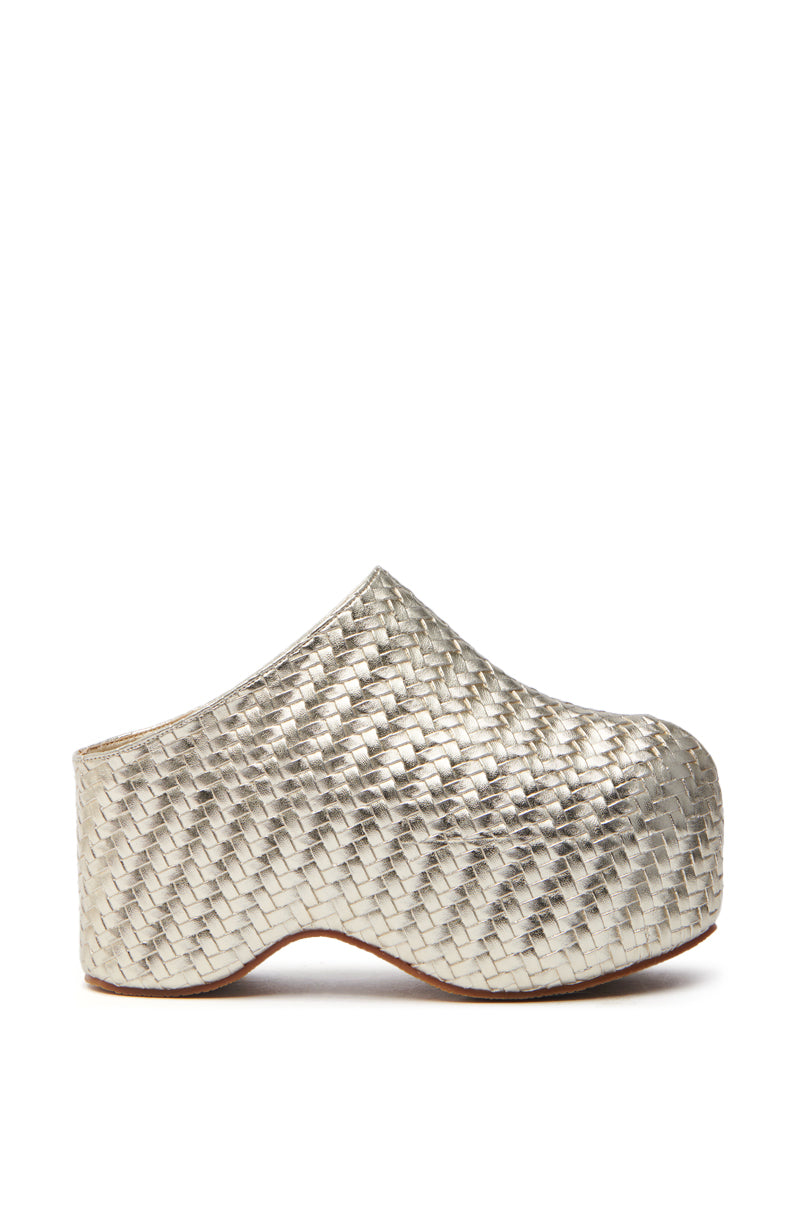 The AZALEA WANG TEATREE GOLD WOVEN CLOG is a silver metallic mule made from vegan leather, featuring a high platform sole with a basket-weave pattern, closed rounded toe, and woven rattan-like design, without any chunky heel or straps.