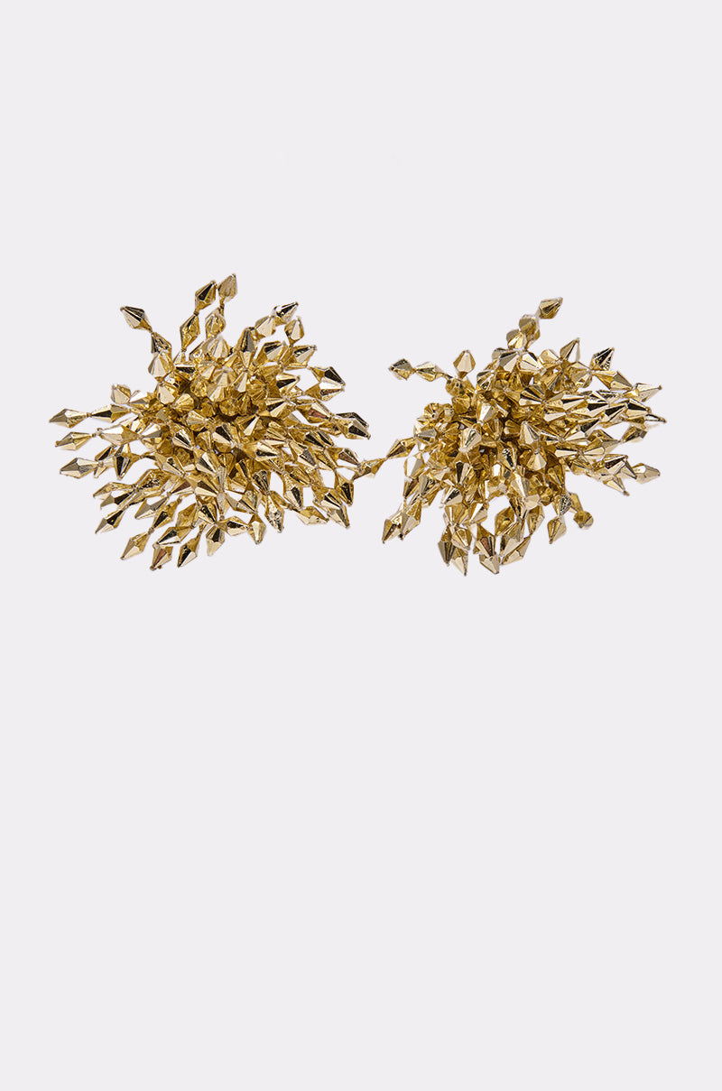 The EDGY VIBE EARRING is a bold pair of gold statement earrings showcasing intricate, clustered designs with multiple small leaf shapes for a textured, dynamic look against a light background. 0
