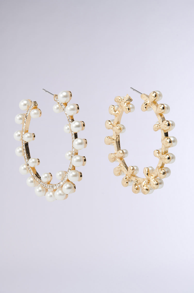 Two hoop earrings from the EVERYTHING YOU WANT EARRING set, one in faux gold with rounded beads and another with pearl detailing and rhinestone embellishments, against a light background. 3