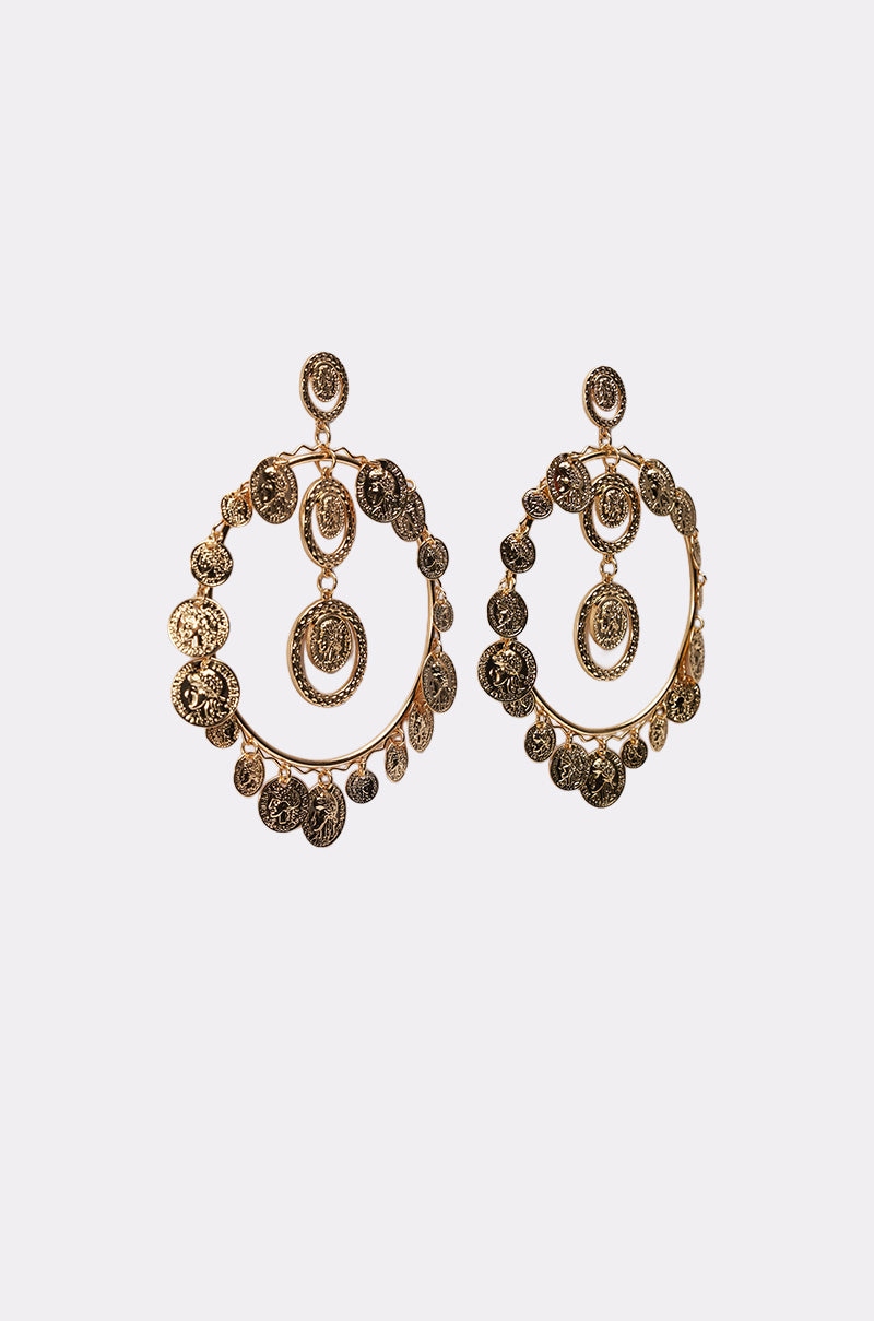 The BOHO EARRING is a pair of large antique gold hoops featuring coin-like charms along the edges and center, showcased on a plain white background. 2