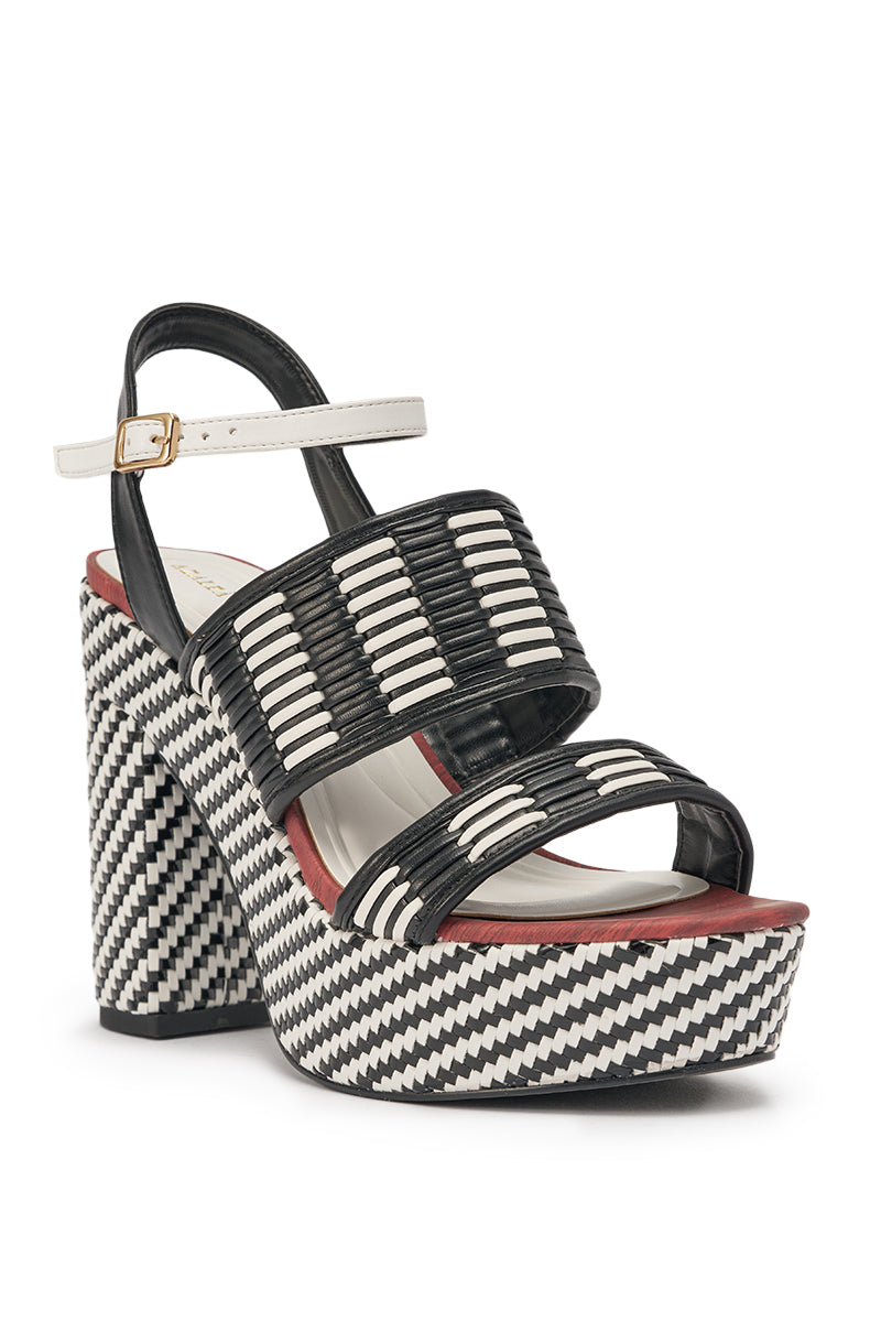 The AZALEA WANG TESERA BLACK WHITE PLATFORM WOVEN SANDAL features thick woven straps, a white ankle strap with gold buckle, open toe, and a bold black-and-white geometric sole for standout style. 3