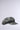 The IT GURL PU BRIM HAT, a gray newsboy cap with an AKIRA label, features a flat round crown and a short faux leather brim, displayed against a plain light gray background for a modern look.