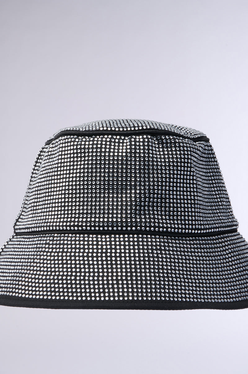 The PAY ME BLING BUCKET HAT from the AKIRA Label features a black design with small, evenly spaced rhinestones that create a sparkling, textured effect against a plain light gray background.