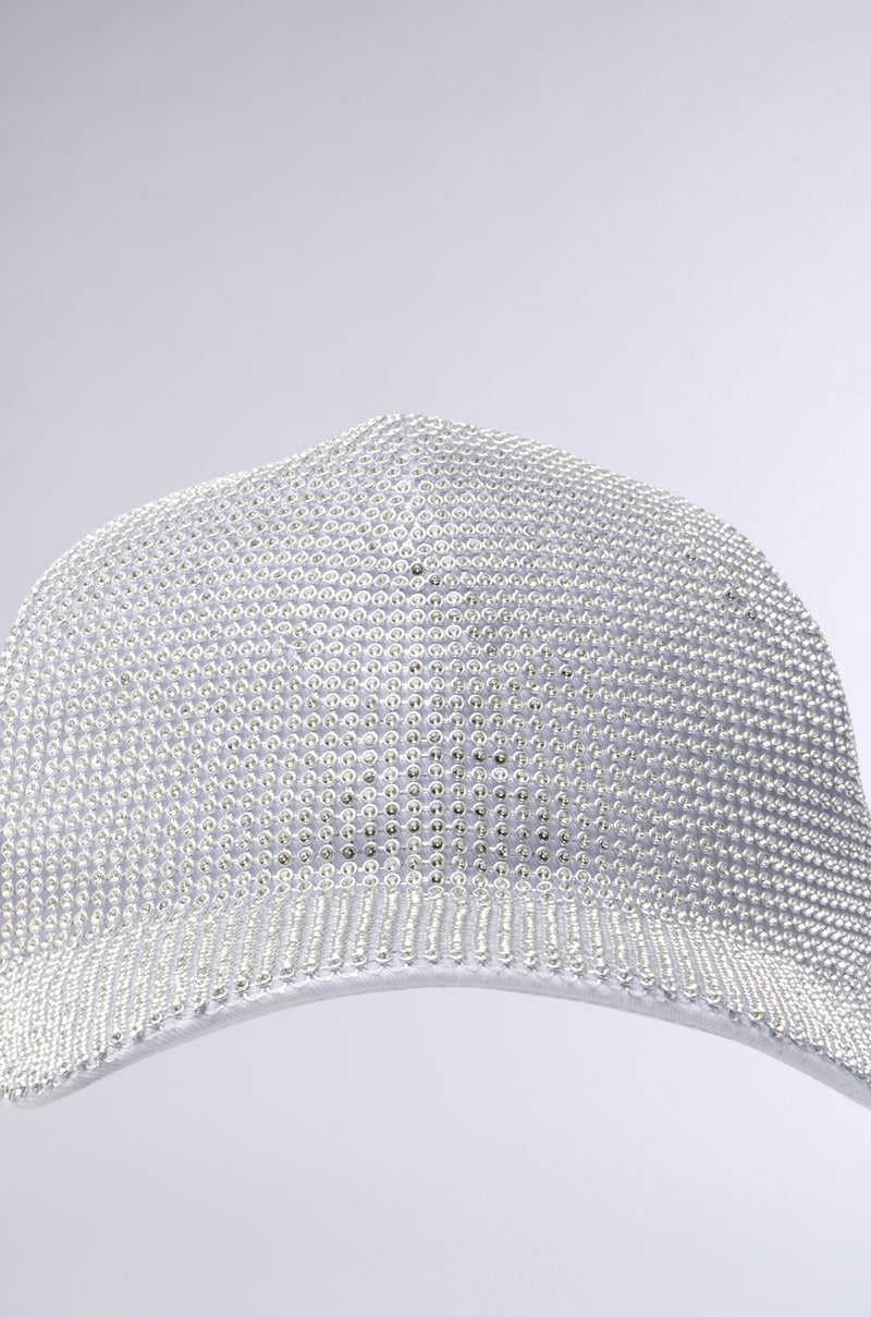 A close-up of the IM RICH BLING SNAPBACK, featuring a dazzling rhinestone overlay with shiny silver stones, shown against a plain light gray background. 4