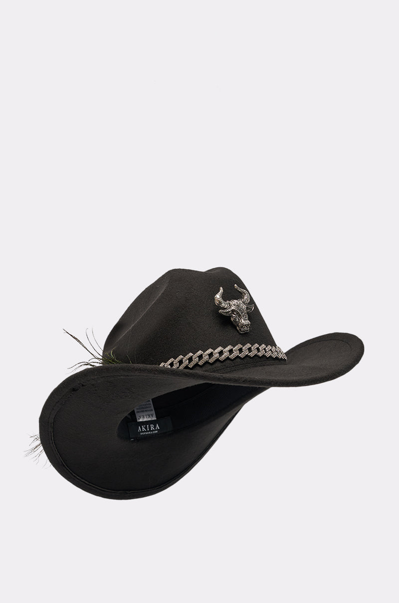 The LETS RIDE COWBOY HAT is a black cowboy hat with a silver bull head and chain on the band, featuring a slightly tilted curved brim, shown on a plain white background. 2