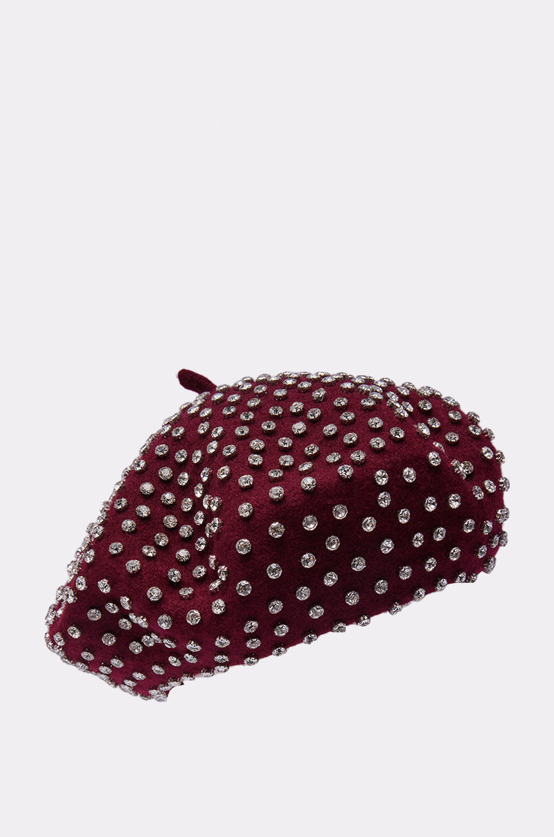 THE REAL RELATE EMBELLISHED BERET, a burgundy wool beret adorned with evenly spaced silver studs, is displayed against a plain white background. 4