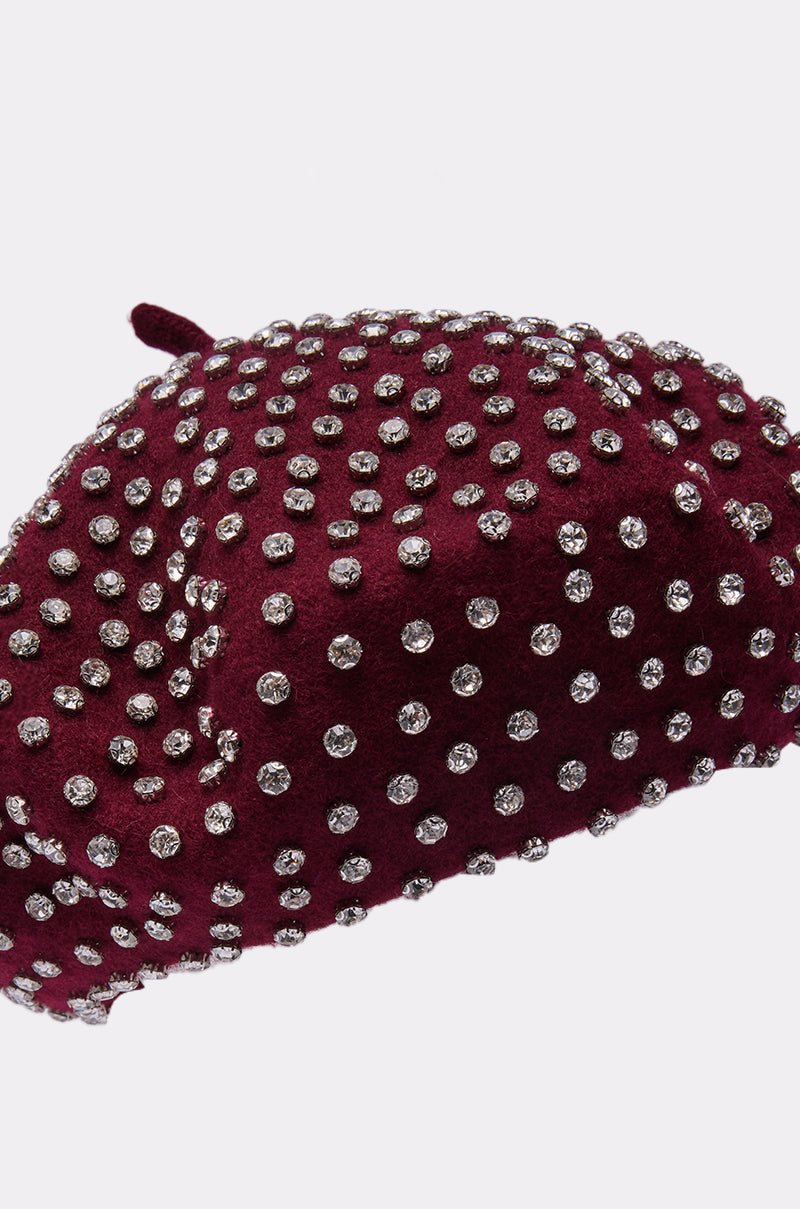 THE REAL RELATE EMBELLISHED BERET in burgundy, adorned with evenly spaced round silver studs, is displayed against a plain light background. 5