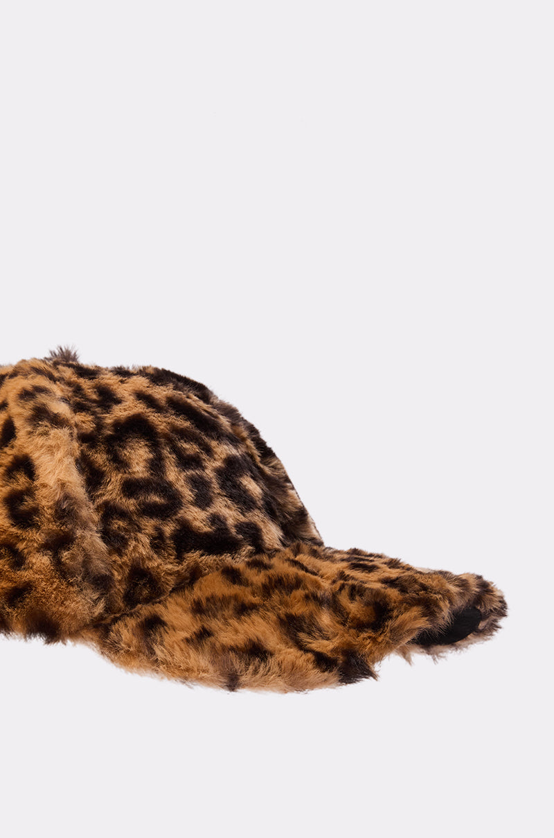 A close-up of the WILD CHILD CHEETAH FUR SNAPBACK, an adjustable baseball cap made from faux fur with a brown and black cheetah print, shown against a plain white background. 3