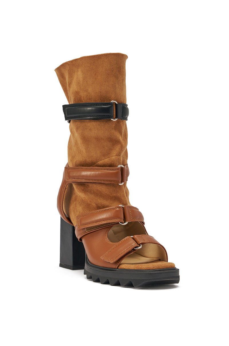 The AZALEA WANG THIERRY TAN FAUX SUEDE OPEN TOE CHUNKY BOOTIE features a tan faux suede upper, open toe, black chunky heel, black and brown adjustable straps, and a rugged black sole in a bootie-sandal hybrid design. 3