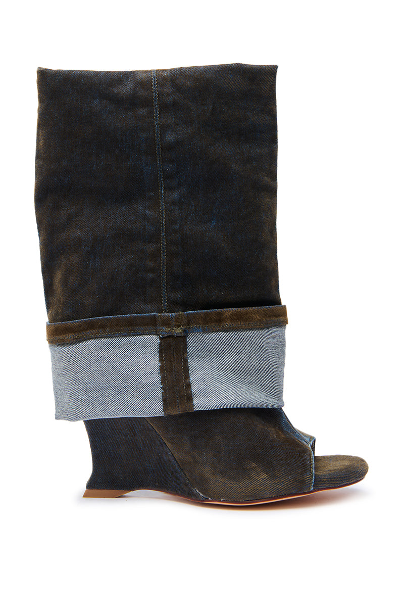The AZALEA WANG TIN BROWN CUFFED WEDGE BOOTIE features a dark denim-like fabric, wide folded cuff, open toe, and wedge heel. This chic mid-calf boot stands upright on a plain white background.