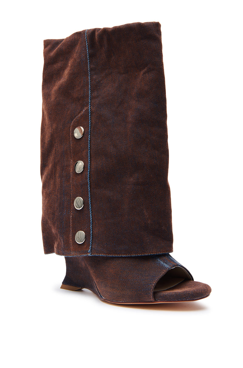 The AZALEA WANG TINSELED BURNT ORANGE HIDDEN WEDGE OPEN TOE BOOTIE features a burnt orange suede finish, a hidden wedge heel, an open toe, and a folded slouchy shaft with four metallic side buttons.