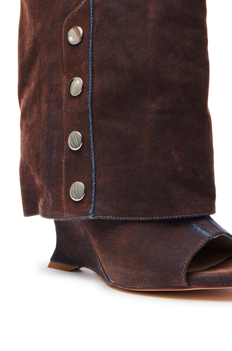 Close-up of the AZALEA WANG TINSELED BURNT ORANGE HIDDEN WEDGE OPEN TOE BOOTIE, featuring a hidden wedge, blue stitching, four silver side buttons, and an open toe design.
