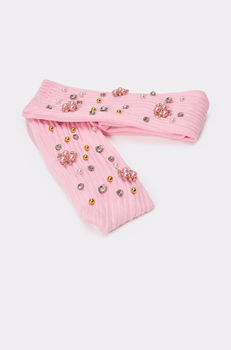The EMBELLISH ME SOCKS are pink ribbed crew socks adorned with gold, silver, and pink beads and rhinestones arranged in floral clusters. 4